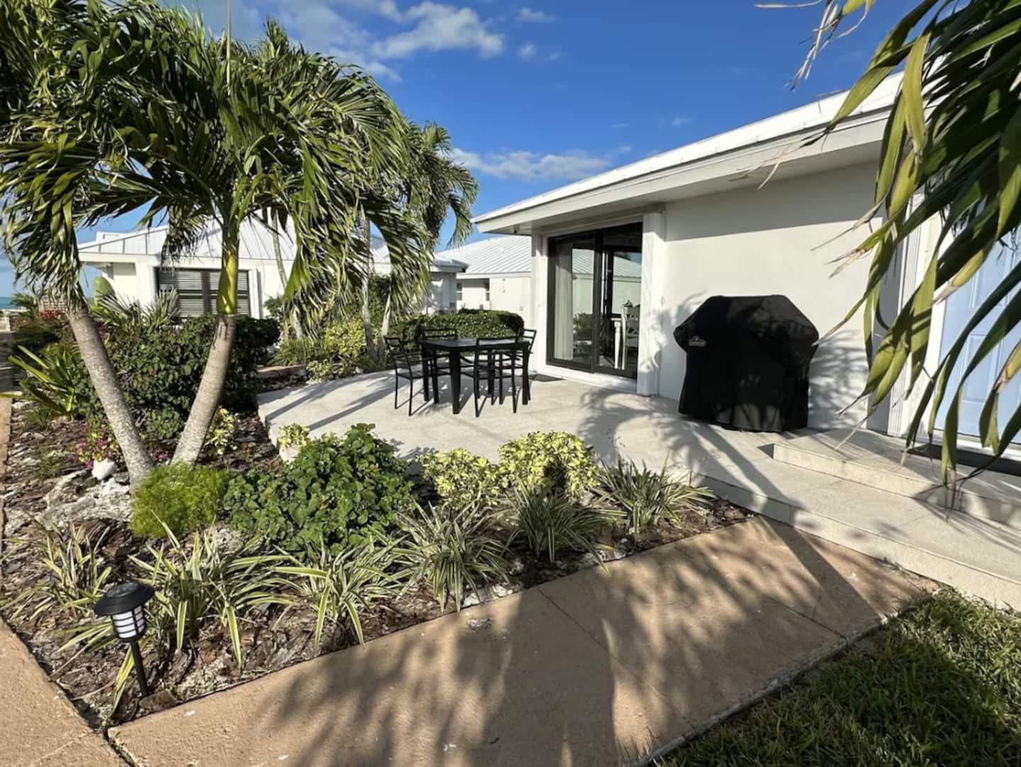 Private patio with outdoor dining and grill