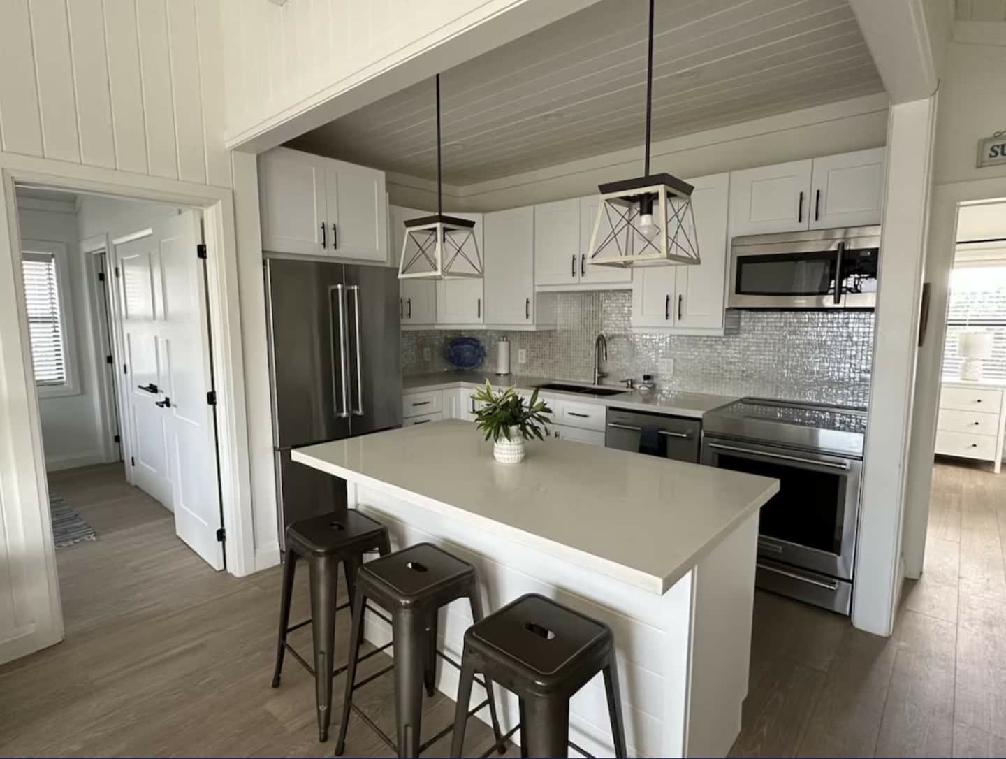 Renovated kitchen with island and stainless appliances